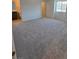 Spacious carpeted bedroom with large windows, offering plenty of natural light and a view at 3654 Stoppani Ave, Henderson, NV 89044