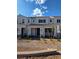 Charming two-story townhome featuring a well-manicured yard, creating a welcoming and picturesque curb appeal at 3654 Stoppani Ave, Henderson, NV 89044