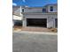 Spacious two-car garage with a brick paver driveway offering ample parking at 3654 Stoppani Ave, Henderson, NV 89044