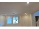 Bright and airy living room with large windows and neutral walls, ready for personalization and comfort at 3654 Stoppani Ave, Henderson, NV 89044
