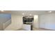 Open concept living space featuring modern gray cabinets, an island, and easy access to the staircase at 3654 Stoppani Ave, Henderson, NV 89044