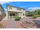 The home has a spacious backyard with a covered patio, desert landscaping, and a charming brick pathway at 3689 Bufflehead St, Las Vegas, NV 89122