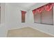 Bright bedroom with tiled floors and window with blinds at 3689 Bufflehead St, Las Vegas, NV 89122