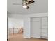 Neutral bedroom featuring ceiling fan, door, and bookshelf at 3689 Bufflehead St, Las Vegas, NV 89122