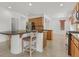 Beautiful kitchen with wooden cabinets, breakfast bar, and tile floors at 3689 Bufflehead St, Las Vegas, NV 89122