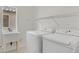 Bright laundry room featuring modern washer and dryer at 3689 Bufflehead St, Las Vegas, NV 89122