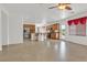 Open floor plan featuring tile flooring, neutral walls, a kitchen, and a sliding glass door to the backyard at 3689 Bufflehead St, Las Vegas, NV 89122