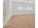 Unfurnished bonus room with neutral walls, carpet flooring, bright windows, and an attached bathroom with a shower at 3689 Bufflehead St, Las Vegas, NV 89122