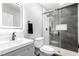 Modern bathroom with black fixtures, tile shower, and vanity sink at 3825 Manhattan Bridge Pl, North Las Vegas, NV 89032