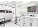 This bathroom features marble tile, double sinks and a sleek, modern shower at 3825 Manhattan Bridge Pl, North Las Vegas, NV 89032