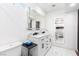 This bathroom features a double sink vanity, large mirror and modern fixtures at 3825 Manhattan Bridge Pl, North Las Vegas, NV 89032