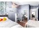 This bedroom has hardwood floors, custom headboard bedframe and mirrored closet doors at 3825 Manhattan Bridge Pl, North Las Vegas, NV 89032