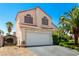 Two-story home featuring a well-maintained front yard with a desert landscaped at 3825 Manhattan Bridge Pl, North Las Vegas, NV 89032