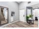 Inviting foyer with staircase, featuring wood-look flooring and neutral wall color at 3825 Manhattan Bridge Pl, North Las Vegas, NV 89032