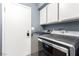 Laundry room with stainless steel washer and dryer units at 3825 Manhattan Bridge Pl, North Las Vegas, NV 89032