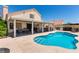 Beautiful backyard pool with covered patio and outdoor entertaining space at 3825 Manhattan Bridge Pl, North Las Vegas, NV 89032