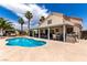 Backyard oasis with a private pool, covered patio, and barbecue area at 3825 Manhattan Bridge Pl, North Las Vegas, NV 89032