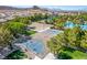 Overhead shot of basketball and sand volleyball courts surrounded by palm trees and landscaping at 389 Fringe Ruff Dr, Las Vegas, NV 89148
