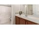 Well-lit bathroom features a tub with tiled backsplash, vanity, and ample counter space at 389 Fringe Ruff Dr, Las Vegas, NV 89148
