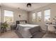 Brightly lit bedroom featuring a bed, desk, and well-placed windows at 389 Fringe Ruff Dr, Las Vegas, NV 89148
