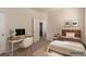 Bedroom with desk, neutral tones and a view to the bath at 389 Fringe Ruff Dr, Las Vegas, NV 89148
