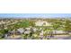 Aerial view of a well-manicured golf course and clubhouse surrounded by palm trees at 389 Fringe Ruff Dr, Las Vegas, NV 89148