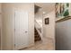 Bright entryway with tile flooring, coat closet and staircase to the second floor at 389 Fringe Ruff Dr, Las Vegas, NV 89148