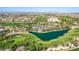 A panoramic aerial view of a golf course with lush fairways, a tranquil pond, and meticulously maintained greens at 389 Fringe Ruff Dr, Las Vegas, NV 89148