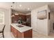 Modern kitchen features an island and stainless steel appliances at 389 Fringe Ruff Dr, Las Vegas, NV 89148