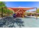 Community playground with colorful sunshades, slides, and ample space for to play at 389 Fringe Ruff Dr, Las Vegas, NV 89148