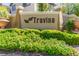 Community entrance signage with lush landscaping and attractive planters at 389 Fringe Ruff Dr, Las Vegas, NV 89148