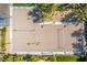 A top-down view of a sand volleyball court with manicured landscaping and ample space for recreational fun at 389 Fringe Ruff Dr, Las Vegas, NV 89148