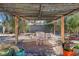 Backyard features a pergola, fire pit, and landscaping at 4343 Sharpshooter Ln, North Las Vegas, NV 89031