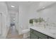 Bright bathroom featuring marble countertop, modern vanity and fixtures at 4369 Meadowlark Wing Way, North Las Vegas, NV 89084