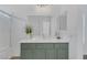 Bathroom features a modern vanity with marble countertop and shower at 4369 Meadowlark Wing Way, North Las Vegas, NV 89084