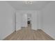 Open bedroom with wood floors leading to a bathroom and fireplace at 4369 Meadowlark Wing Way, North Las Vegas, NV 89084