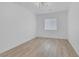 Bright bedroom with hardwood flooring and stylish light fixture at 4369 Meadowlark Wing Way, North Las Vegas, NV 89084