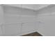 Walk-in closet with shelving units and ample storage space for clothing at 4369 Meadowlark Wing Way, North Las Vegas, NV 89084