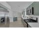 Open kitchen showcases stainless steel appliances and modern design elements at 4369 Meadowlark Wing Way, North Las Vegas, NV 89084