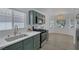 Modern kitchen features stainless appliances, modern countertops, and views to dining area at 4369 Meadowlark Wing Way, North Las Vegas, NV 89084