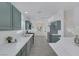 Well-appointed kitchen with green cabinets, modern appliances, and eat-in island at 4369 Meadowlark Wing Way, North Las Vegas, NV 89084