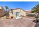 Cozy backyard with a brick patio, hammock, and mature trees, providing a relaxing outdoor space at 4428 Los Reyes Ct, Las Vegas, NV 89121