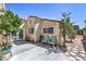 Relaxing backyard with patio space, seating and mature trees providing ample shade at 4428 Los Reyes Ct, Las Vegas, NV 89121