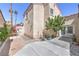 Rear of home showing well maintained grounds and dual patio doors at 4428 Los Reyes Ct, Las Vegas, NV 89121