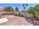 Private backyard features brick patio and stone wall, perfect for entertaining and relaxation at 4428 Los Reyes Ct, Las Vegas, NV 89121