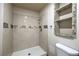 This bathroom boasts a fully-tiled walk-in shower and built-in shelving at 4428 Los Reyes Ct, Las Vegas, NV 89121