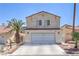 Charming two-story home with a well-maintained front yard and a two-car garage, perfect for a Gathering at 4428 Los Reyes Ct, Las Vegas, NV 89121
