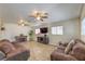 Comfortable living room featuring modern décor, a fireplace, and ample seating at 4428 Los Reyes Ct, Las Vegas, NV 89121