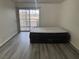 Bedroom with wood-style flooring and slider access to balcony at 4555 E Sahara Ave # 288, Las Vegas, NV 89104