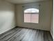 Bright bedroom with hard surface floors and a window with blinds at 4555 E Sahara Ave # 288, Las Vegas, NV 89104